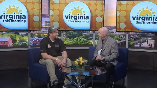 Jeff Williams of Blazer Heating, Air, and Plumbing sits with the host of Virginia This Morning on a news set. | Blazer Heating, Air, and Plumbing