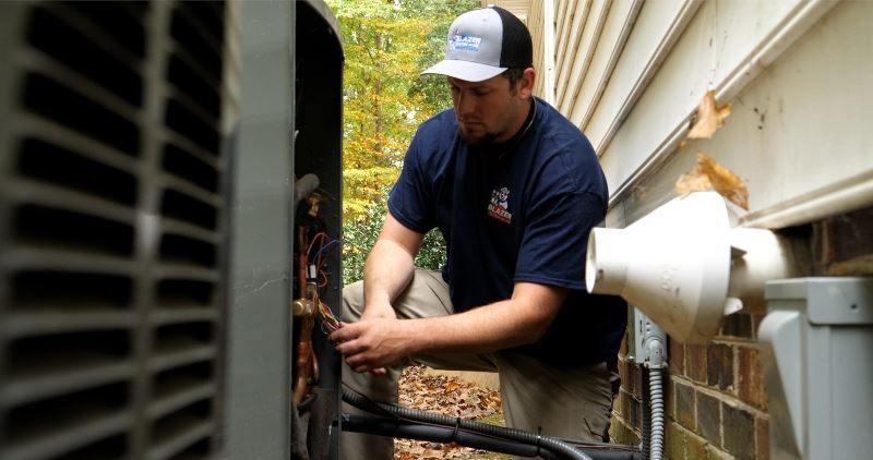 Blazer tech working on heating unit